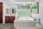 En Suite Master Bath Includes Walk-In Shower With Skylight, Bathtub and Double Sink Vanity